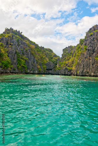PALAWAN, PHILIPPINES - DECEMBER 21, 2023: Blue lagoon tropical landscape at the Coron island bay in Palawan province Philippines. 6 million foreign tourists visited Philippines in 2016. © Scotts Travel Photos