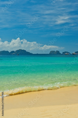 Fototapeta Naklejka Na Ścianę i Meble -  PALAWAN, PHILIPPINES - DECEMBER 21, 2023: Beach landscape in Palawan island, Philippines. Seven Commandos Beach.. 6 million foreign tourists visited Philippines in 2016.