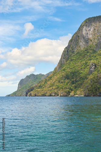PALAWAN, PHILIPPINES - DECEMBER 21, 2023: Tropical Shimizu Island and paradise beach, El Nido, Palawan, Philippines. Tour A Route. Coral reef and sharp limestone cliffs.  © Scotts Travel Photos