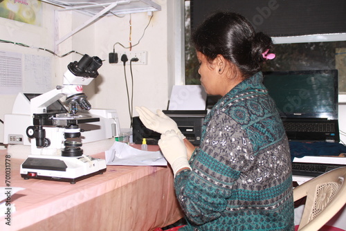 Lady Pathologist processing samples at the pathology laboratory for analysis. Medical diagnosis concept. Medical concept. India