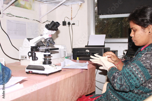 Lady Pathologist processing samples at the pathology laboratory for analysis. Medical diagnosis concept. Medical concept. India
