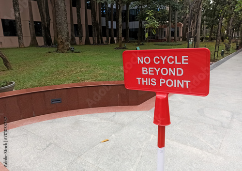 A closeup picture of a sign board restricting the movement of cycles