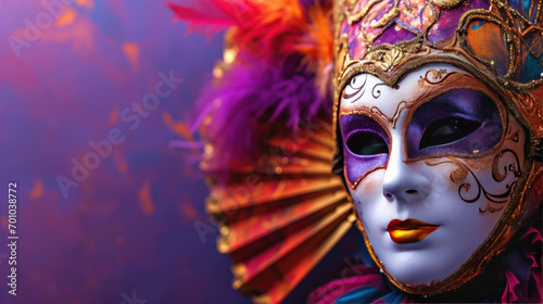 Holidays mardi gras masquarade, venetian mask fan over purple background 