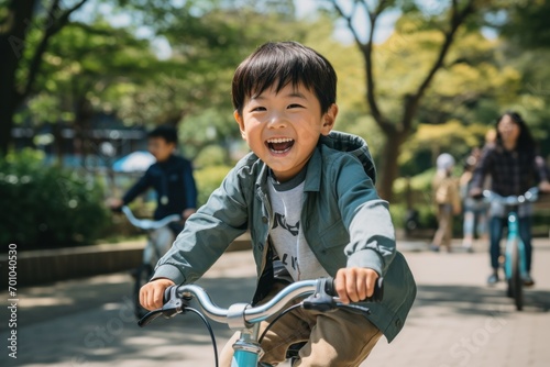 Boy Learning to Ride a Bicycle in Sunny Park 