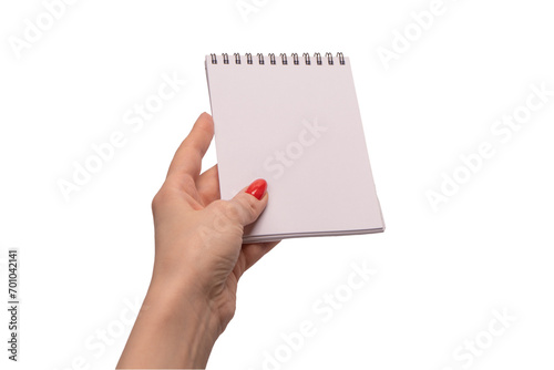 A notebook with empty white paper in woman hands with red nails.