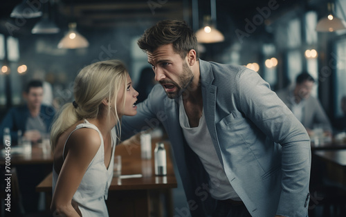 Homem nervoso e ciumento brigando com mulher triste sofre em estabelecimento comercial photo
