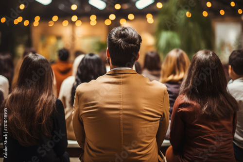 Group of people watching concert or seminar