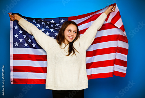 Young girl wrapped in american flag