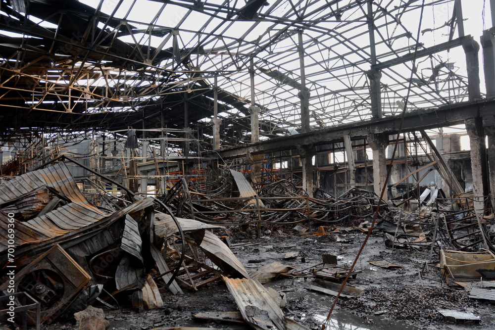 KYIV, UKRAINE - 20231229: A destroyed warehouse with construction materials after a rocket explosion as a result of the attack of the Russian army on Ukraine