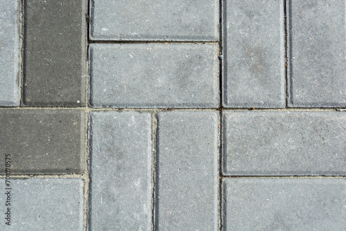 Grey concrete paving slabs. Texture of gray paving slabs.