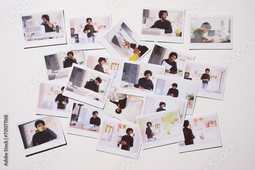 collection of Polaroid photos scattered across a white surface, each frame capturing different facets of a young entrepreneur's work life, from planning to execution. photo