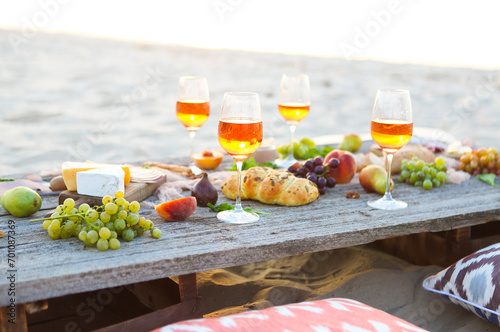 Beach picnic table with rose wine