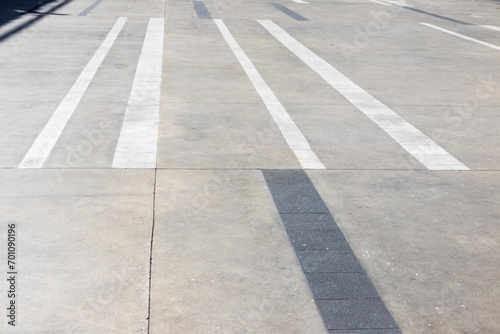 The exterior walkway is made of concrete in a rectangular shape.