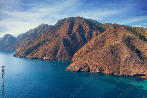 Rocky seashore on a sunny day. Seascape in daylight. Cabo de Gata-Níjar reserve. Almeria Andalusia Spain