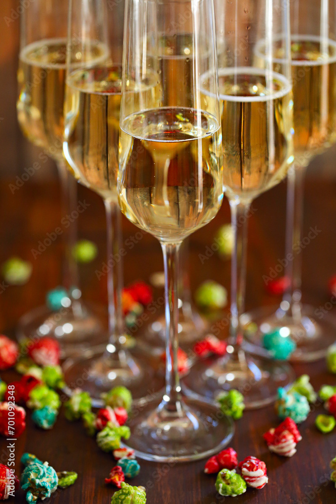 Champagne with pop corn on wooden background Champagne with pop corn on wooden background