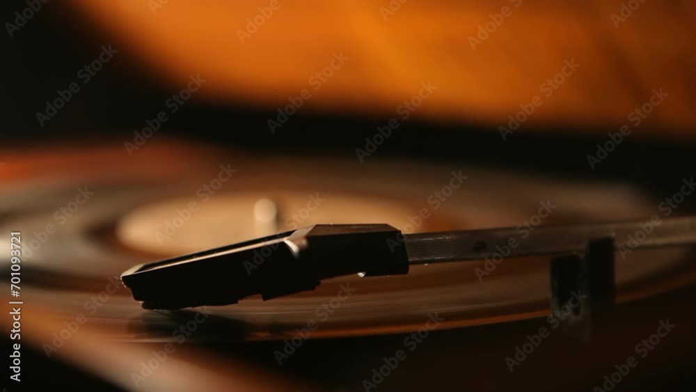 Retro vinyl record player. An old record player spins a record. Listening to music on the player.