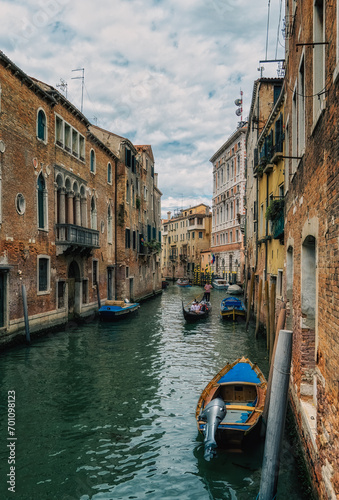 Small canal with boats in Venice, Italy