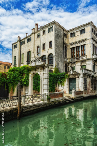 Old house in Venice, Italy. An ancient residential building. Vintage facade of the historical house close-up. Old architecture of Venice