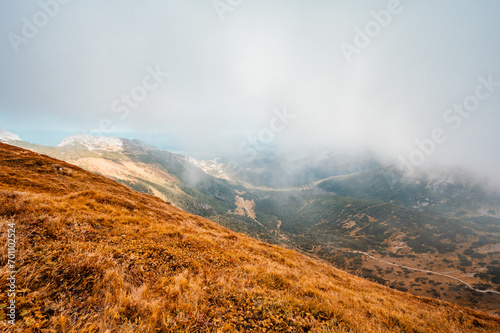 Mountain Tatras landscape. View from ridge of the Poland Tatras. Hiking from Kasprowy Wierch peak to Gievont peak . View on zakopane and Ticha valley. photo