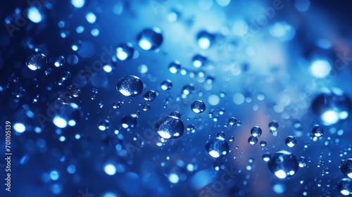 water drops on blue background macro close up with selective focus and shallow depth of field