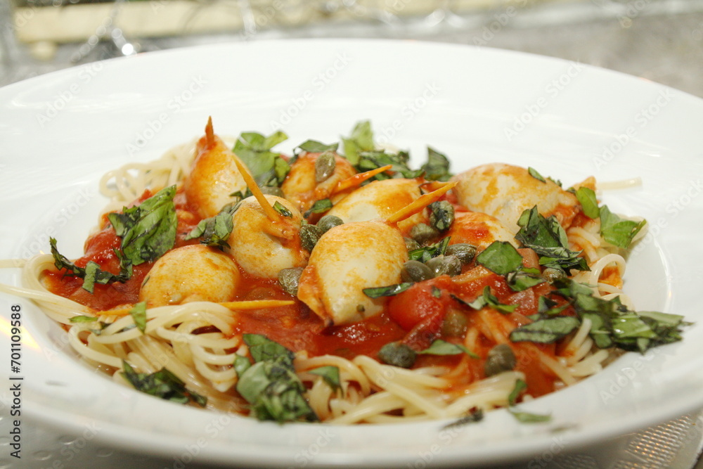 Squid tubes stuffed with pecorino, breadcrumbs, capers, pasta, tomato sauce, basil, garlic, parsley, Italian dish, Squid tubes stuffed with pecorino, breadcrumbs, capers, pasta, tomato sauce, basil, garlic, parsley, Italian dish,