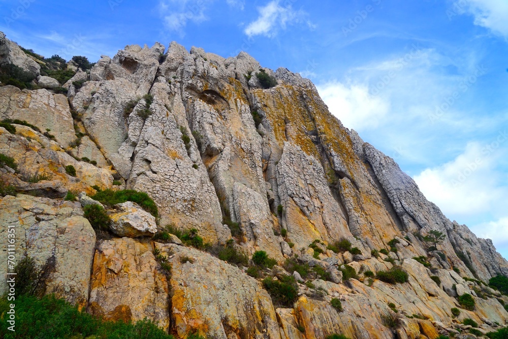 Fototapeta premium landscape in the mountains, wall of rocks and Moorish Cave near Bolonia, Cueva del Moro, Andalusia, Spain