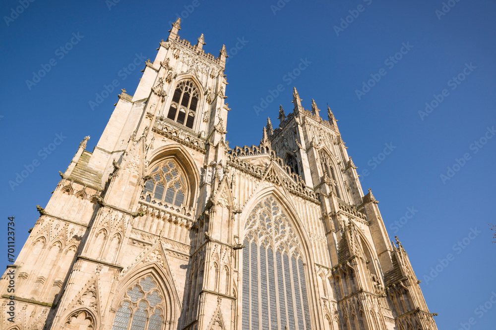 Exterior of York Minster cathedral against a blue sky, York, UK