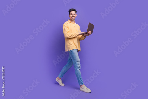 Full size photo of attractive man instagram twitter facebook telegram dressed stylish yellow clothes isolated on purple color background
