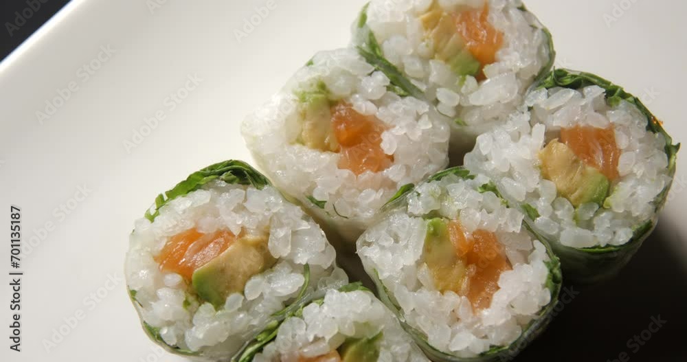 Sushis rotating close ups on black background 4K