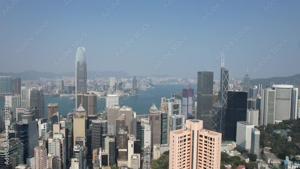 City Skyview in Hong Kong Island 4K Aerial shot of the peak premium residential mansion villa area at mid level and the central financial business along the sides of the Victoria Harbour City Skyview in Hong Kong Island 4K Aerial shot of the peak premium residential mansion villa area at mid level and the central financial business along the sides of the Victoria Harbour