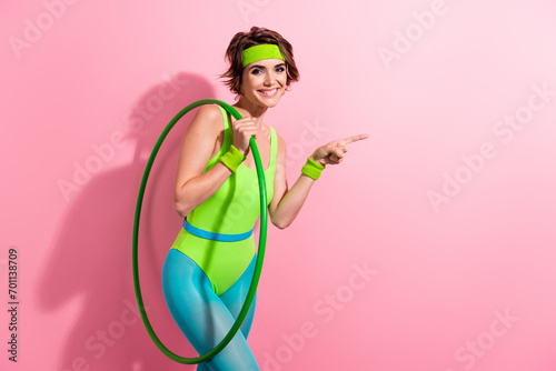 Photo of lady coach hold hula hoop demonstrate sport gym club promo with fitness exercise isolated pastel color background