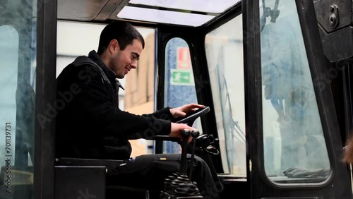 Man driving forklift after talking with manager woman