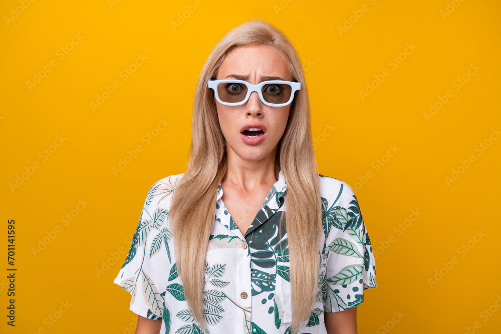 Portrait of terrified speechless woman with straight hairstyle wear 3d glasses staring open mouth isolated on yellow color background