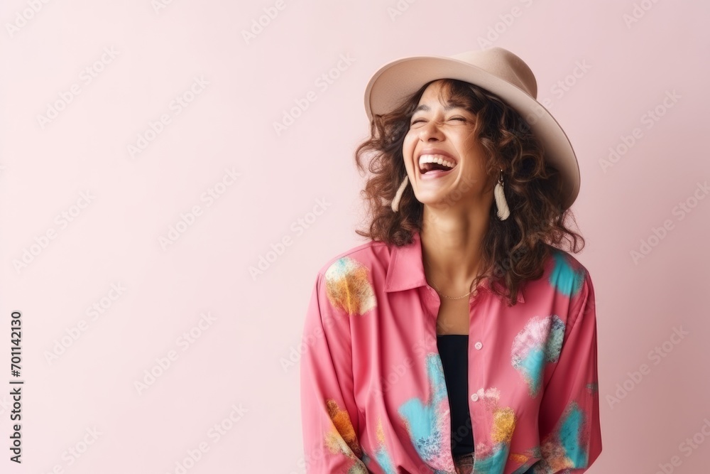 Portrait of beautiful young woman in hat and shirt on pink background Portrait of beautiful young woman in hat and shirt on pink background