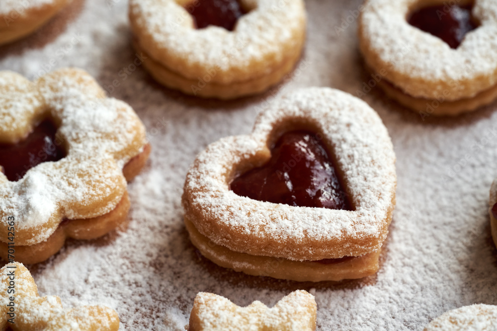 Closeup of Linzer Christmas cookies dusted with sugar