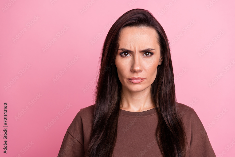 Portrait of unsatisfied disappointed lady sullen face bad mood empty space isolated on pink color background Portrait of unsatisfied disappointed lady sullen face bad mood empty space isolated on pink color background