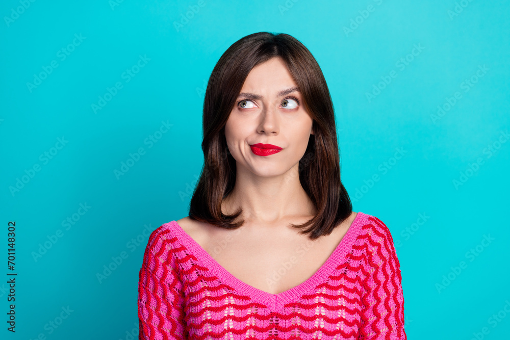 Photo of minded pensive woman with straight hairdo dressed knitwear top thoughtfully look empty space isolated on blue color background Photo of minded pensive woman with straight hairdo dressed knitwear top thoughtfully look empty space isolated on blue color background