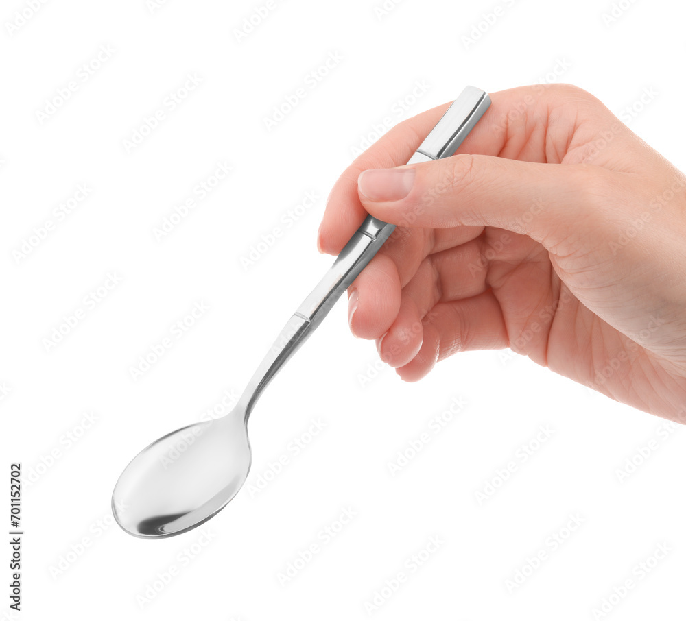 Woman holding new shiny spoon on white background, closeup Woman holding new shiny spoon on white background, closeup