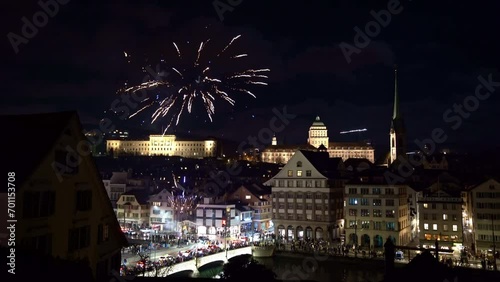 Colorful Happy New Year 2024 fireworks at Swiss City of Zürich on a dark winter night. Movie shot January 1st, 2024, Zurich, Switzerland.