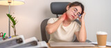 Woman having Neck and Shoulder pain during work long time on workplace. due to fibromyalgia, rheumatism, Scapular pain, office syndrome and ergonomic concept