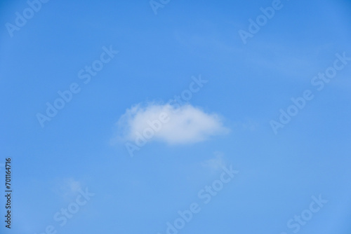 beautiful blue sky and white fluffy single cloud with sunrise in the morning  natural background