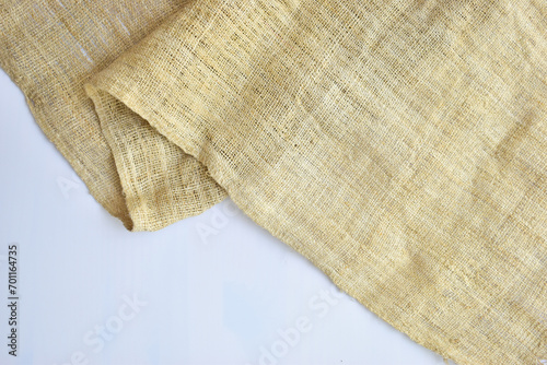 torn sackcloth isolated on white background, burlap fabric texture for design