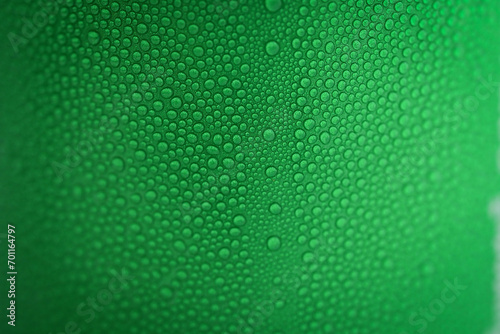 water drop on green beverage cans background, texture of cold aluminium package photo