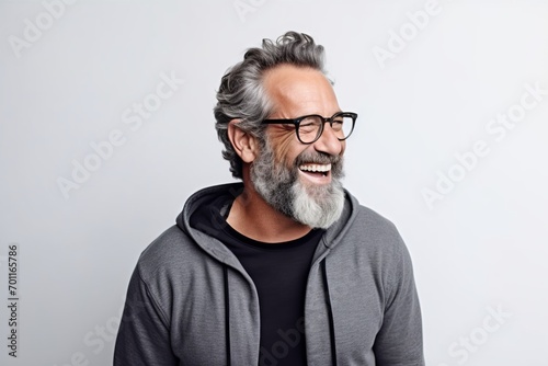Portrait of a happy senior man with grey hair and eyeglasses
