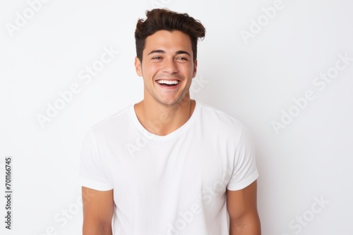Portrait of happy young man in white t-shirt, isolated on white background