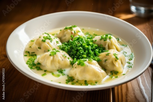 Canederli or Knodel in broth with green onion pasta dumplings