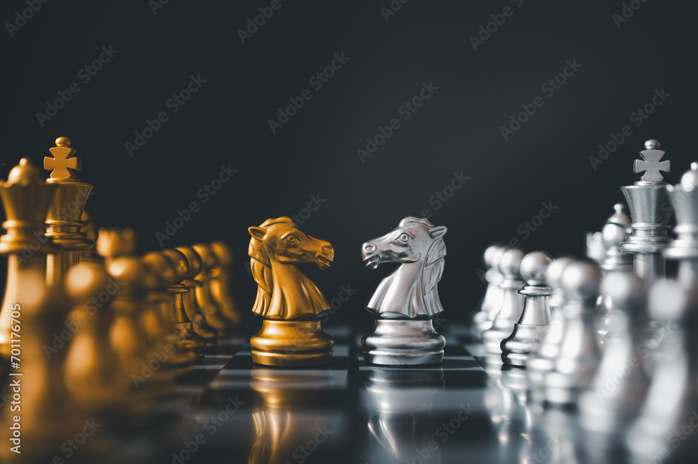 horse golden chess and horse silver chess standing face to face of the ...