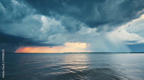 The calm before the storm: serene lake waters under a tumultuous sky, showcasing nature's contrasts. photo