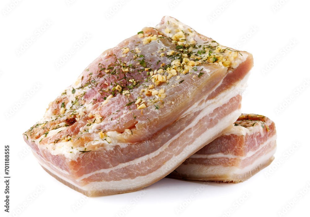 Appetizing salty lard with layers of meat with garlic and herbs. Two pieces of salted lard isolated on a white background. Appetizing salty lard with layers of meat with garlic and herbs. Two pieces of salted lard isolated on a white background.