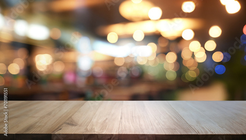 Empty dark wooden table in front of abstract blurred bokeh background of restaurant . can be used for display or montage your products. Mock up for space